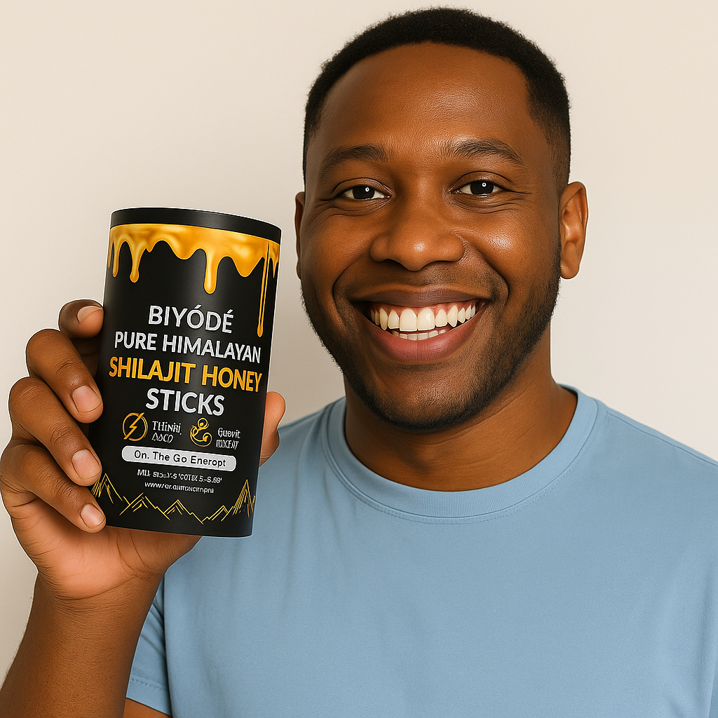 Smiling man holding a container of Biyodé Pure Himalayan Shilajit Honey Sticks dietary supplement.